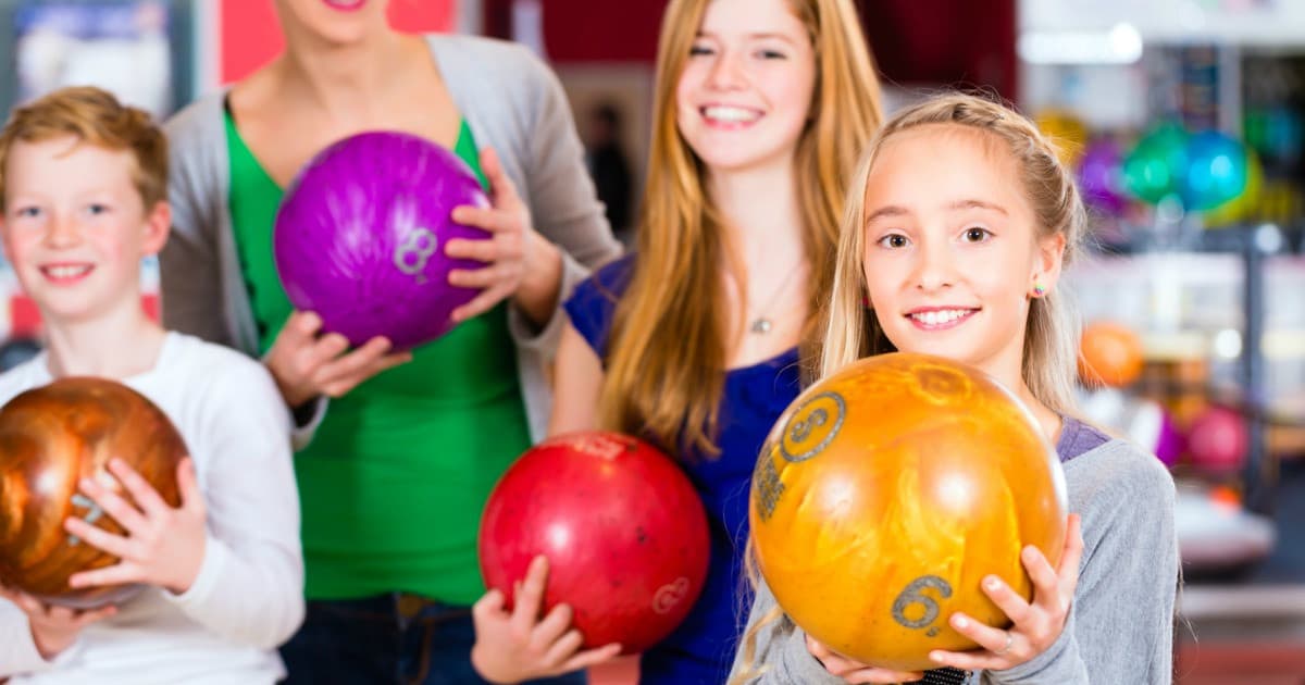 Register your child on KidsBowlFree.com and they can bowl two FREE games at participating locations every day throughout the summer!
Go with a group. Although it varies by center, sharing a lane is generally more economical than bowling solo.
Ask about a season pass or membership. Some centers have loyalty programs that offer discounts or give opportunities to earn free games. It doesn’t hurt to ask!
Join a league. If you like the competitive aspect of bowling, consider joining a league. Although you’ll have to pay dues upfront, games and practice times are often part of the package. Plus, you’ll get a cool bowling shirt!
Check your local thrift shop for gently used bowling shoes. Even when you get to bowl a free game or two, you’ll usually have to pay for the cost of renting shoes. If you bowl often, owning your own pair will save you lots of money in the long run!
Avoid the snack bar. Bowling alley snacks can be pricey, so eat before you go and bring a reusable water bottle to stay hydrated. Some centers won’t mind if you pack a snack for the kids, but do ask in advance and bring something that won’t leave a mess.